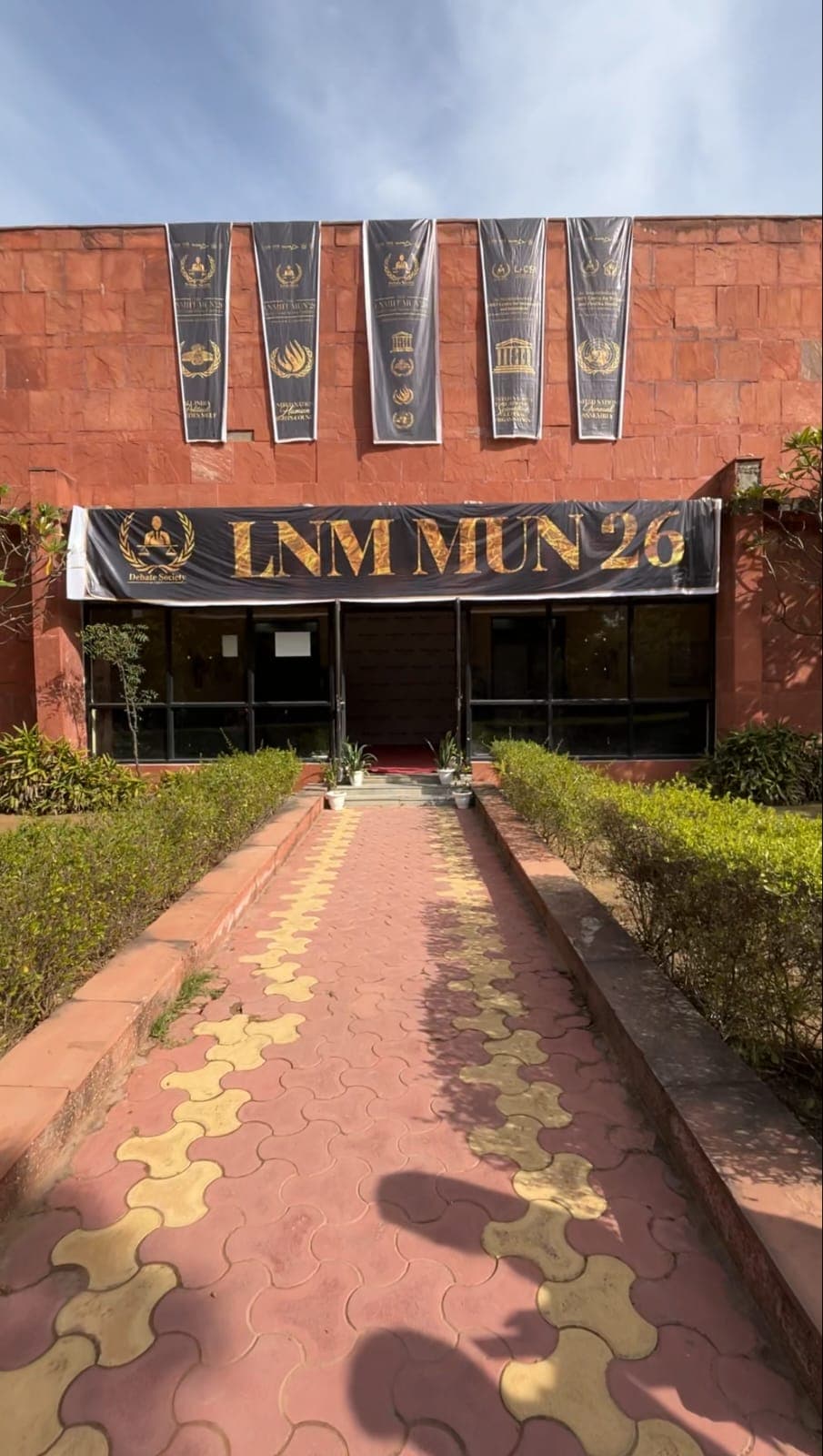 The LNM MUN 26 banner above the conference venue entrance.